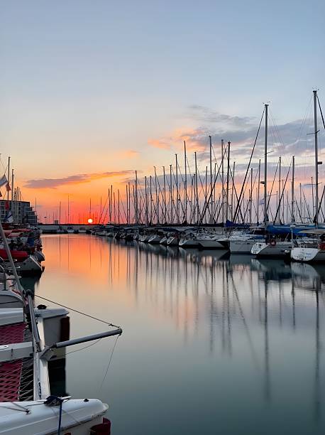 istock Sunset over a tranquil marina with sailboats. 2212337251