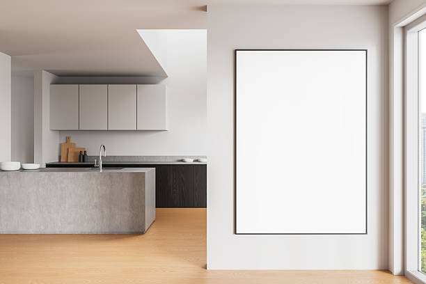 istock Blank poster mockup on modern wall in bright minimalist kitchen interior with wooden floor and natural light through window for clean presentation. 3D Rendering 2212337607