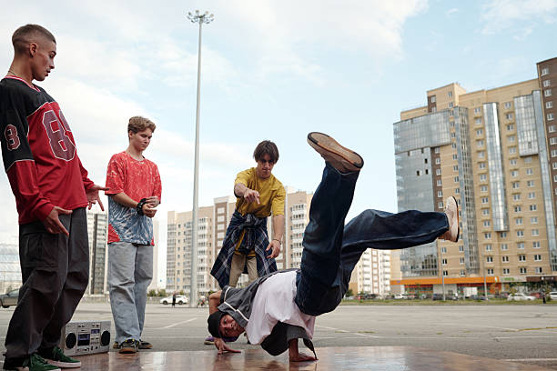 istock Performing Breakdance Moves in Urban Setting 2212339275
