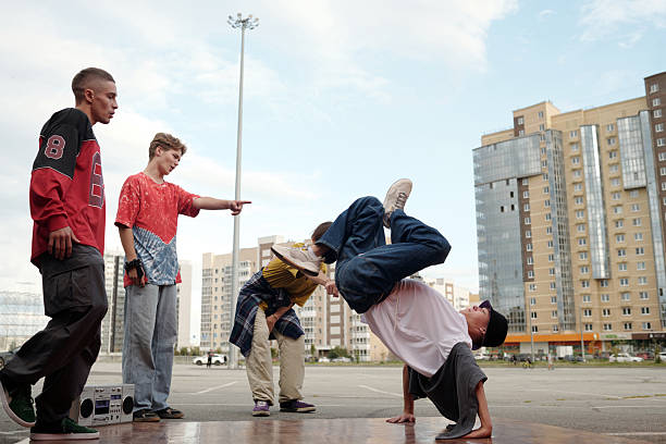 istock Breakdancing Performers Showcasing Skills in Urban Setting 2212339375