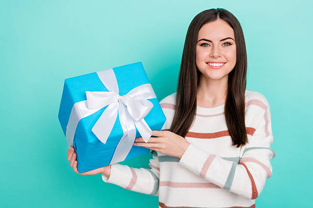 istock Photo of cute charming lady dressed striped pullover rising present box isolated teal color background 2212339892
