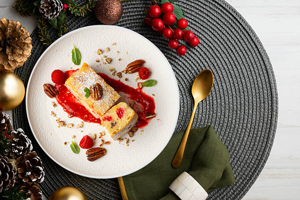 istock White chocolate brownie with walnuts and raspberries top view table with christmas decorations. 2212340729