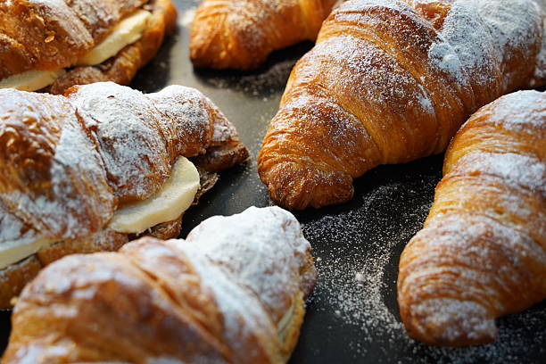 istock Delicious Croissants with Butter and Powdered Sugar 2212340830