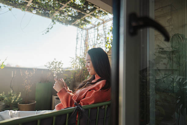 istock Young woman using mobile phone 2212342031