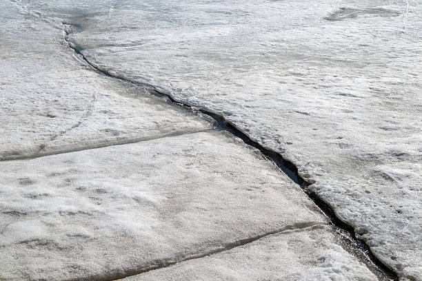 istock cracks on the melting sea ice surface 2212343257