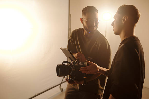 istock Camera Crew Looking at Monitor Screen 2212343828