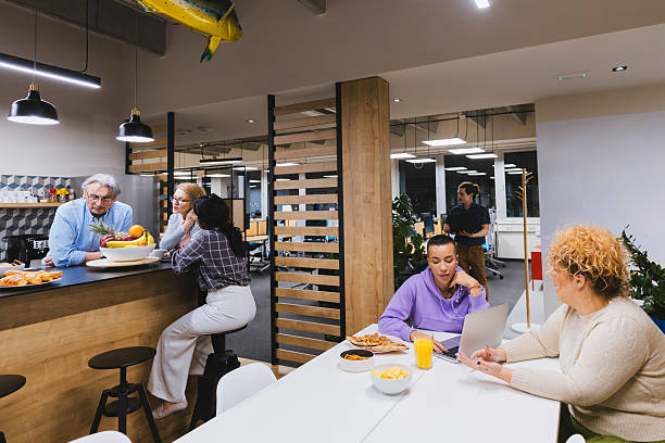 istock Groups of multicultural businesspeople working and talking at coworking space. 2212345793