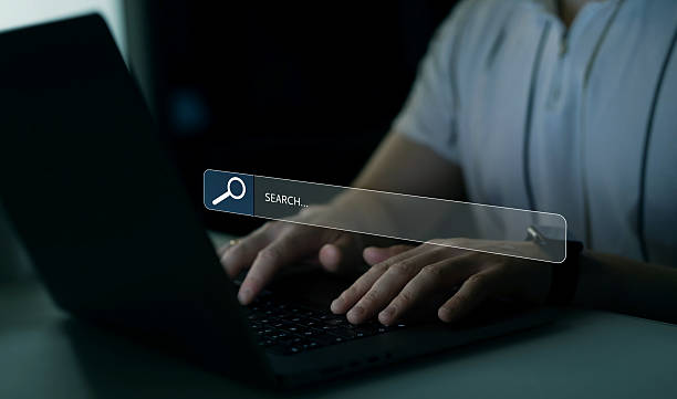 istock Person clicking internet search page on touch screen. Searching information on internet. SEO searching. 2212346949
