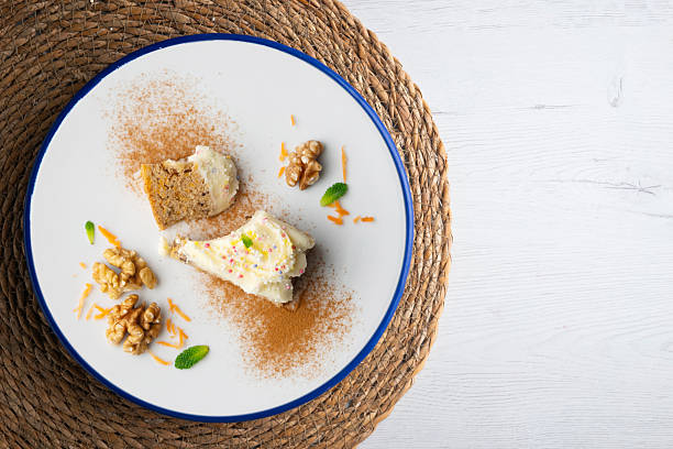 istock Carrot and walnut cake with cream cheese frosting. Top view table. 2212353700