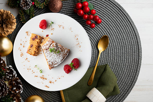 istock Whole wheat vegan cake with fresh fruit. Top view table with christmas decorations. 2212356555