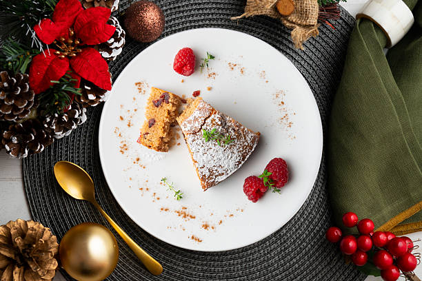 istock Whole wheat vegan cake with fresh fruit. Top view table with christmas decorations. 2212356584