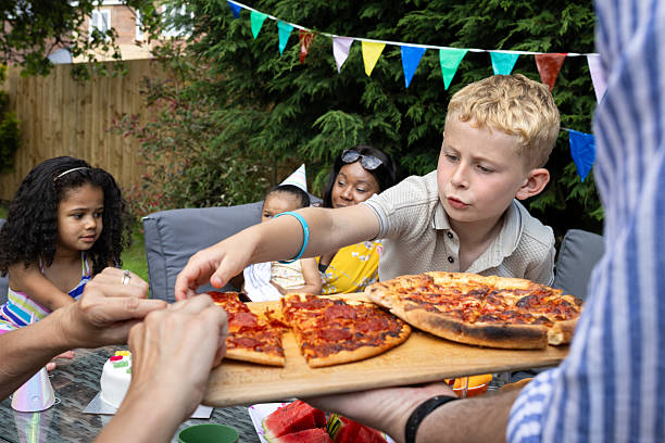 istock Enjoying A Slice Of Pizza 2212364030