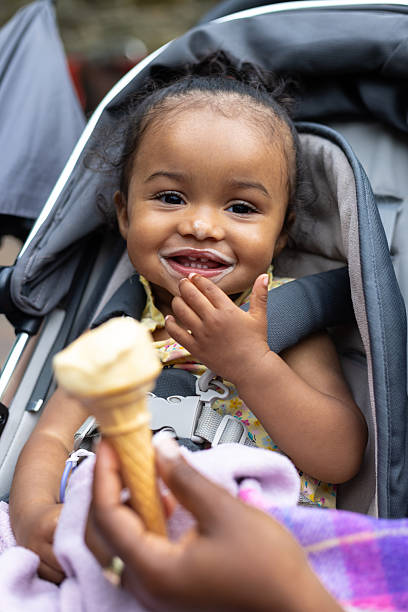 istock Adorable Toddler Eating Ice Cream 2212364149