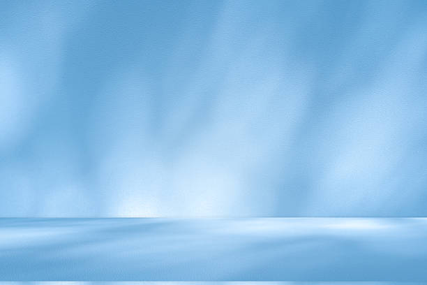 istock Studio style background wall decoration presentation uses white and blue tones. with shadows cast from a nearby window, concept creating a decorative 2212364573
