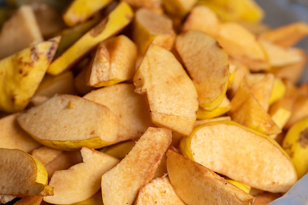 istock Freshly sliced yellow apples ready for baking or snacking in a cozy kitchen environment 2212365633