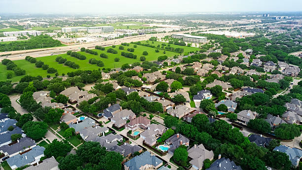 istock Vacant land with trees along Dallas North Tollway in rapid growing mixed use development area of business park campus buildings, upscale residential neighborhood home along West Plano Parkway 2212369224