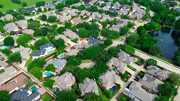istock Lakeside mansion homes with solar panel roof, modern inground pools in upscale suburban neighborhood green space near Steeplechase Park and Balcones Drive in Plano, Texas, suburbs Dallas, aerial 2212369231