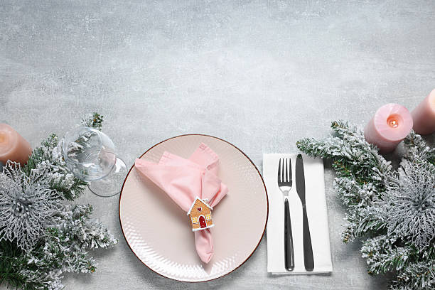 istock Christmas place setting with festive decor on grey textured table, flat lay. Space for text 2212370222