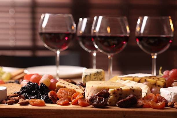 istock Glasses of red wine and different snacks on table, selective focus 2212370898