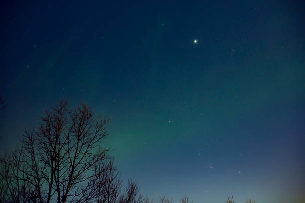 istock Aurora borealis, polar lights with Milky Way stars. 2212372592