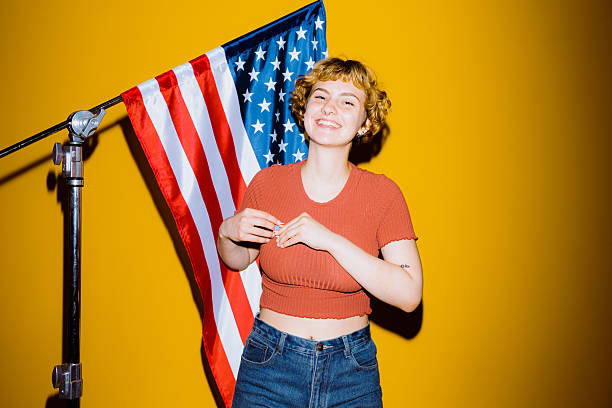 istock Joyful celebration in front of an American flag backdrop 2212374486