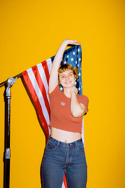 istock Joyful celebration with an American flag backdrop and vibrant colors 2212374544