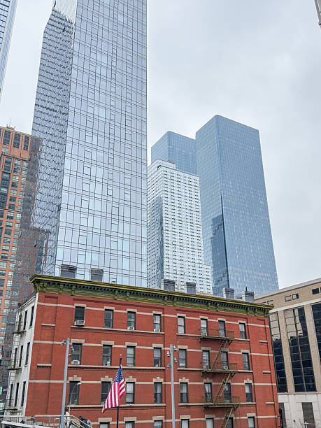 istock Urban Skyline with Historic Brick Building and Skyscrapers 2212375480