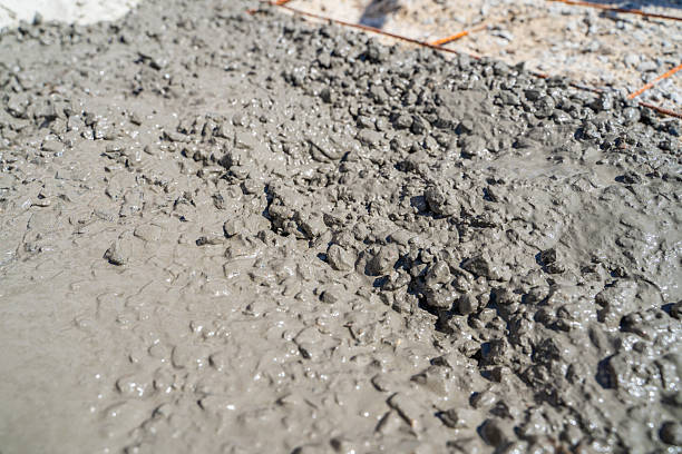 istock Fresh mixture of cement with crushed stone close-up 2212380832