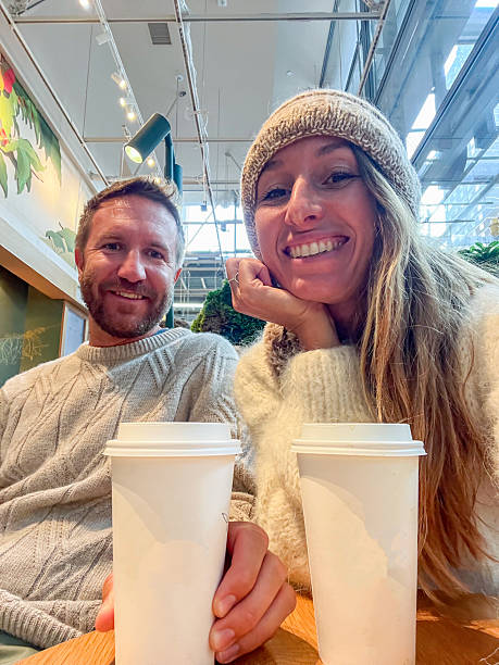 Couple Enjoying Coffee Together in a Modern Cafe