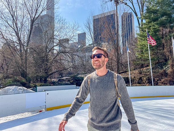 istock Man Ice Skating in Urban Park on a Sunny Day 2212384231