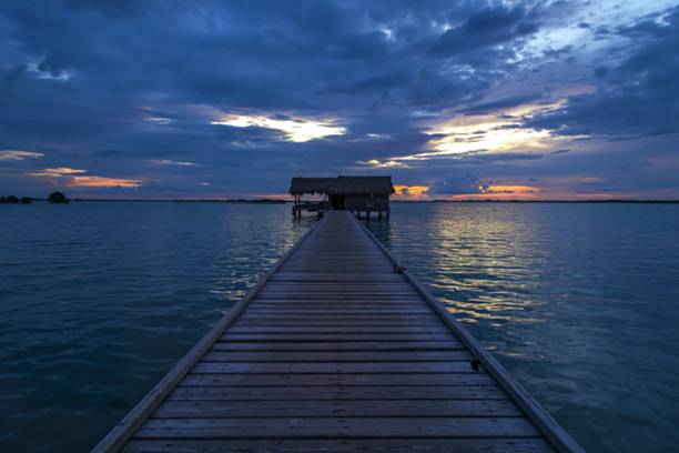 istock a serene waterscape during the transition between day and night 2212384539