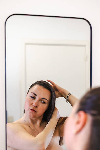 istock Woman Combing Hair - Daily Beauty Routine 2212386927