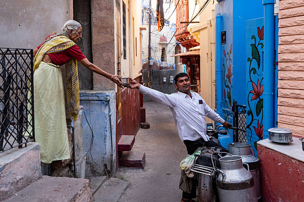 India. State of Rajasthan. Jodhpur. Scene from daily life. A milk delivery man makes his rounds
