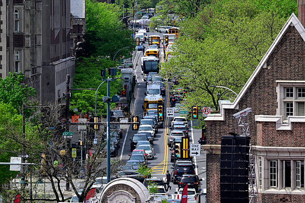 A busy street with a lot of cars and a bus. Scene is chaotic and stressful