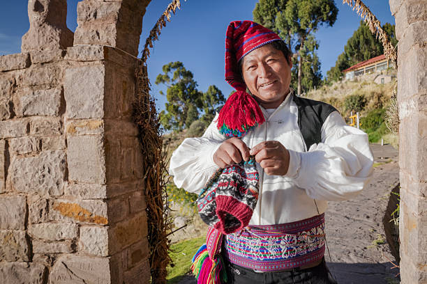 istock Man knitting a hat on Taquile Island, Lake Titicaca, Peru 2212391636