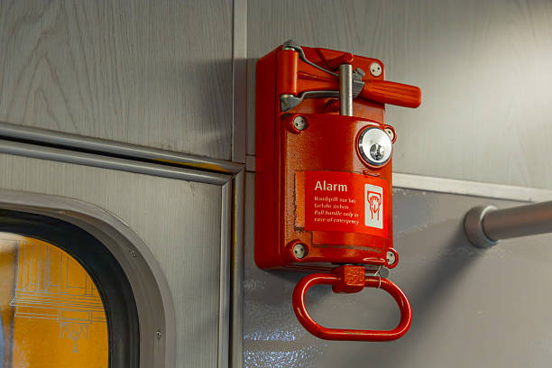 istock Close-up of a red emergency alarm handle inside a subway Berlin 2212393211