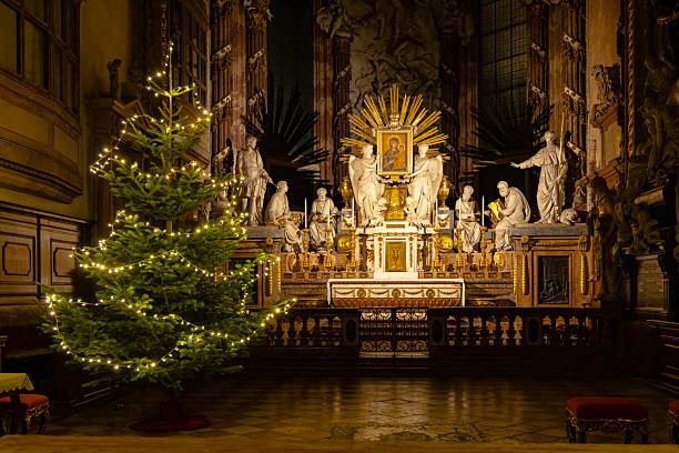 Decorated christmas tree illuminating the baroque altar of a church