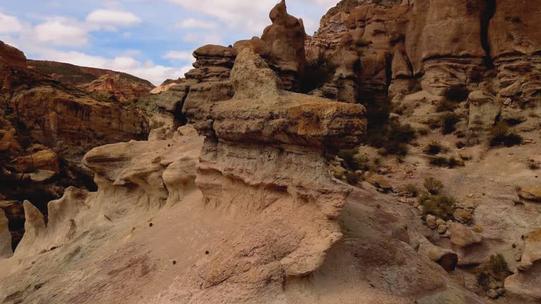 Unusual rock formation shaped by erosion in Atuel Canyon, Mendoza, Argentina. Aerial drone footage.