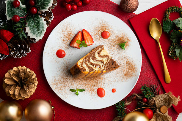 istock Zebra chocolate cake with decorative lines. Top view table with christmas decorations. 2212399228