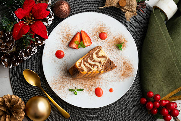 istock Zebra chocolate cake with decorative lines. Top view table with christmas decorations. 2212399233