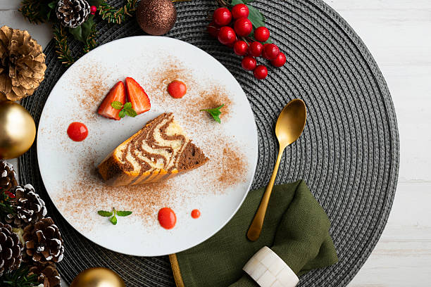 istock Zebra chocolate cake with decorative lines. Top view table with christmas decorations. 2212399238