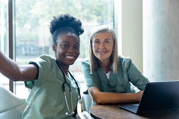istock Two doctors colleagues making selfie together and looking contented 2212399329