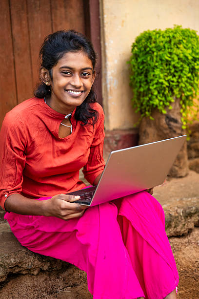 istock Sri Lankan young woman using a laptop 2212399361