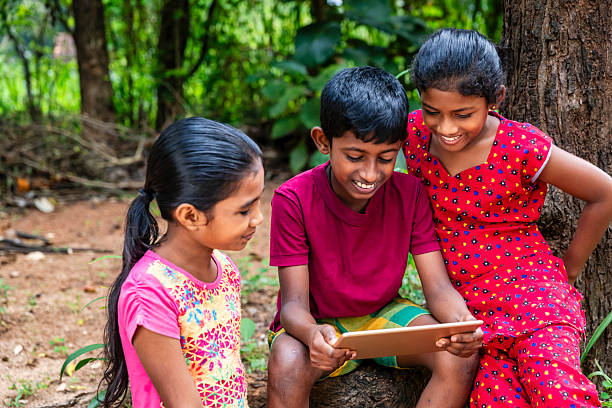 istock Sri Lankan teenagers using a digital tablet 2212399583