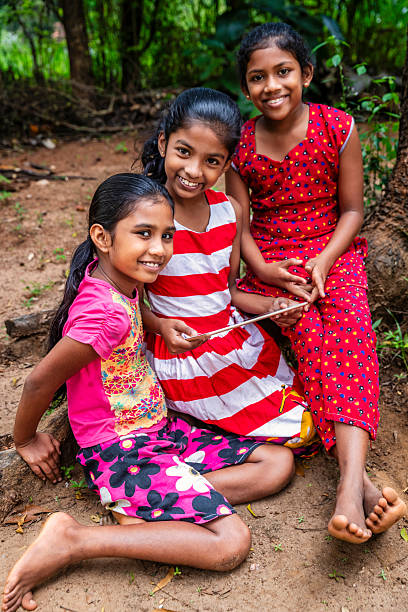 istock Sri Lankan young girls using a digital tablet 2212399704