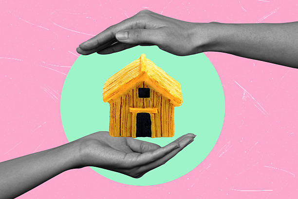 istock Art collage featuring hands and house in the middle. 2212399806