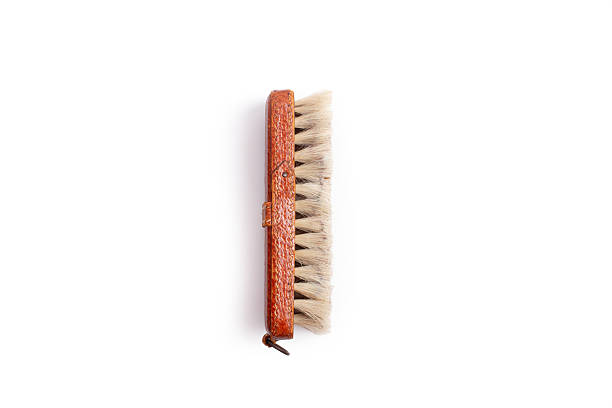 A leather brush with bristles isolated on a white background