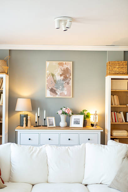 istock Modern living room interior design with white sofa and stylish decor 2212402819