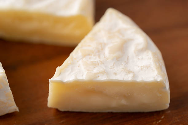 istock Close-up of sliced Camembert cheese 2212403790