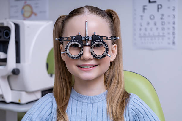 istock Fair-haired school age girl having an optometry test in clinic 2212404898